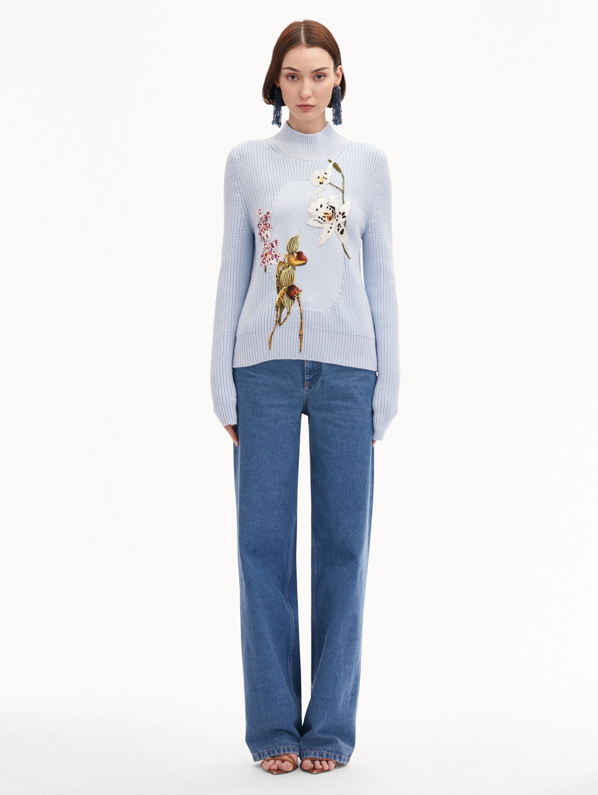 Light Blue Orchid Embroidered Portrait Pullover Styled with Jeans
Front View