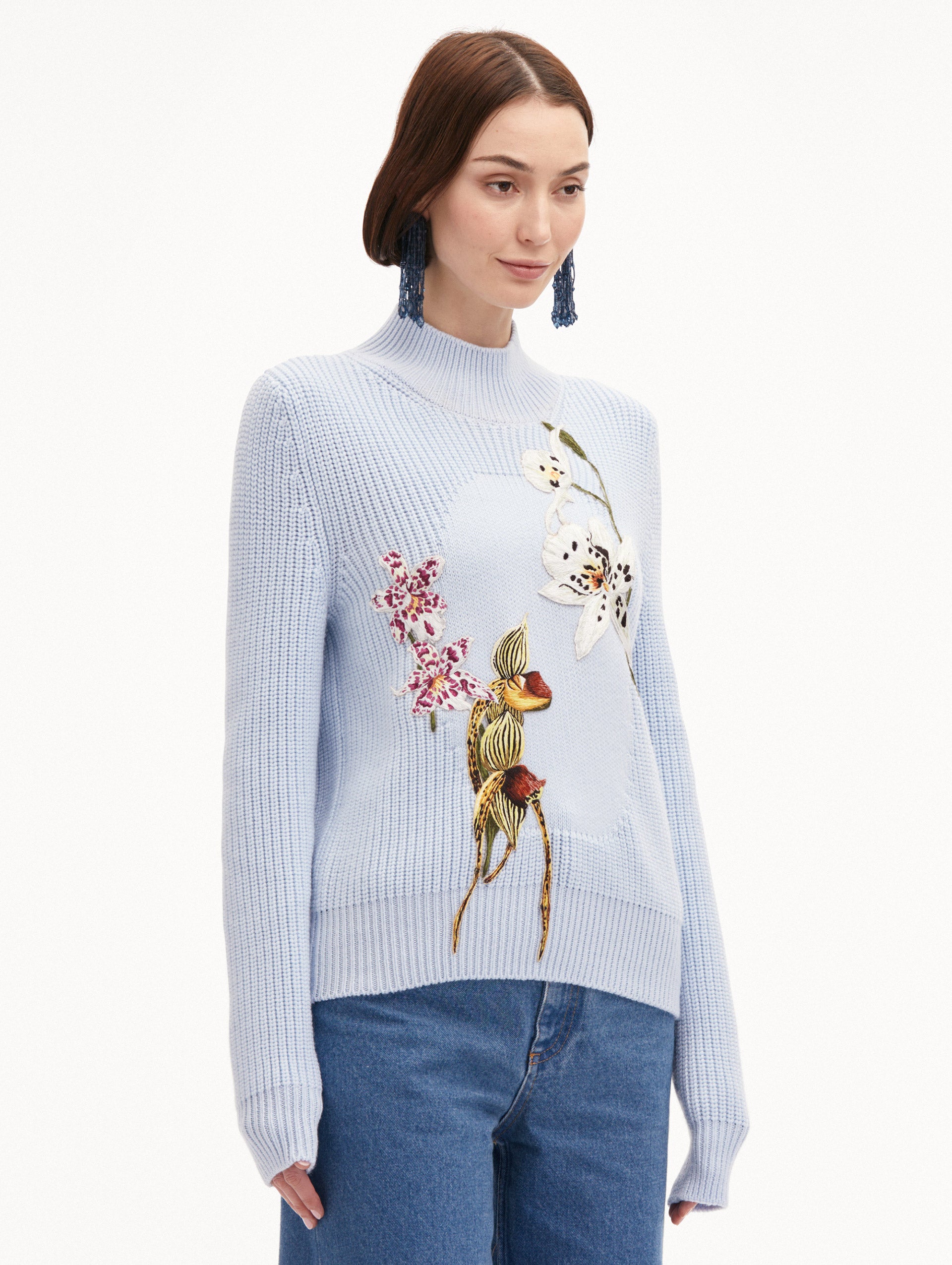 Light Blue Orchid Embroidered Portrait Pullover Styled with Jeans
Side View