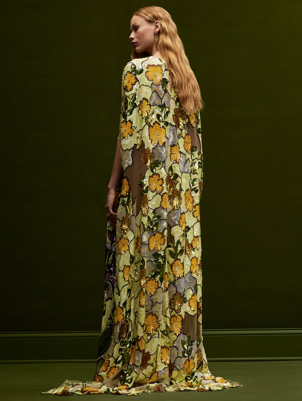 The model faces backwards while wearing an Art Nouveau Sequin Flower Caftan.