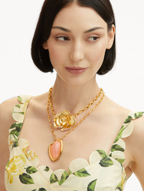 Pavé Rose Pendant Necklace in Gold, Layered with an O Pendant Necklace and Styled with Floral Dress Front View